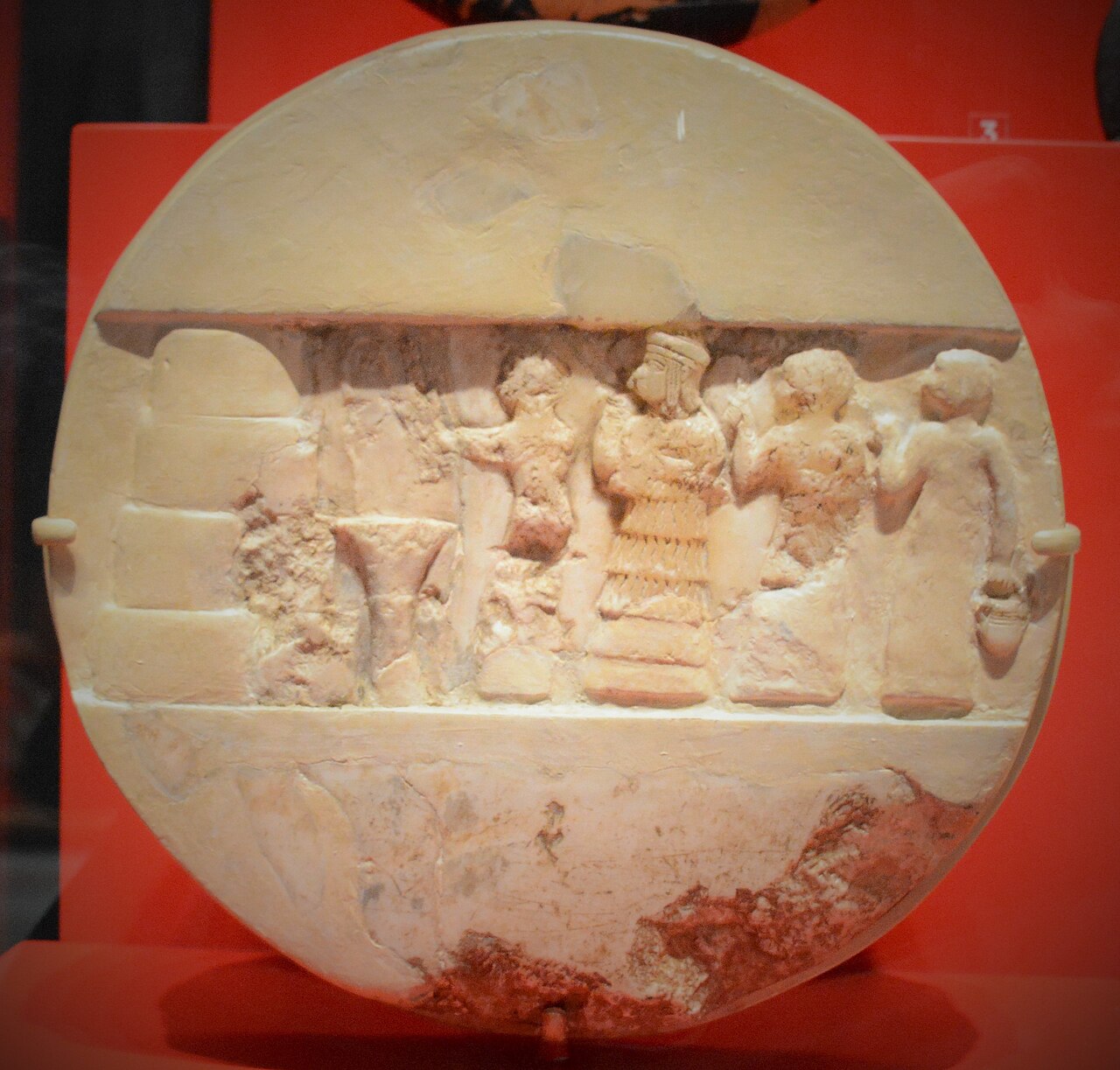 Calcite disk of Enheduanna, reconstructed, carved ritual scene on the face.